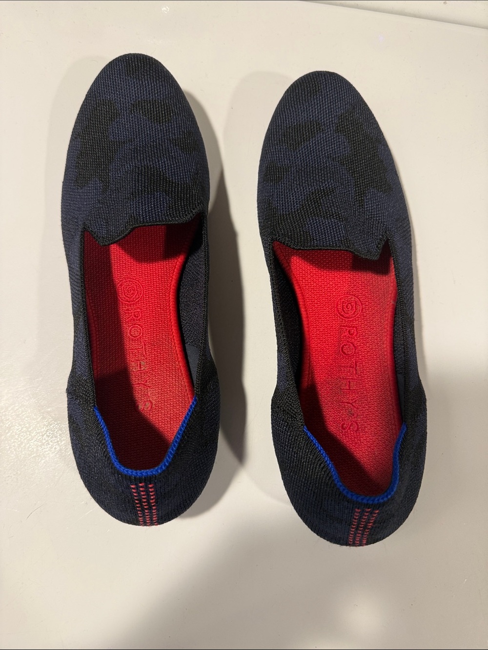 Rothy's Women's Slip-On Flats in Black with Red Insole